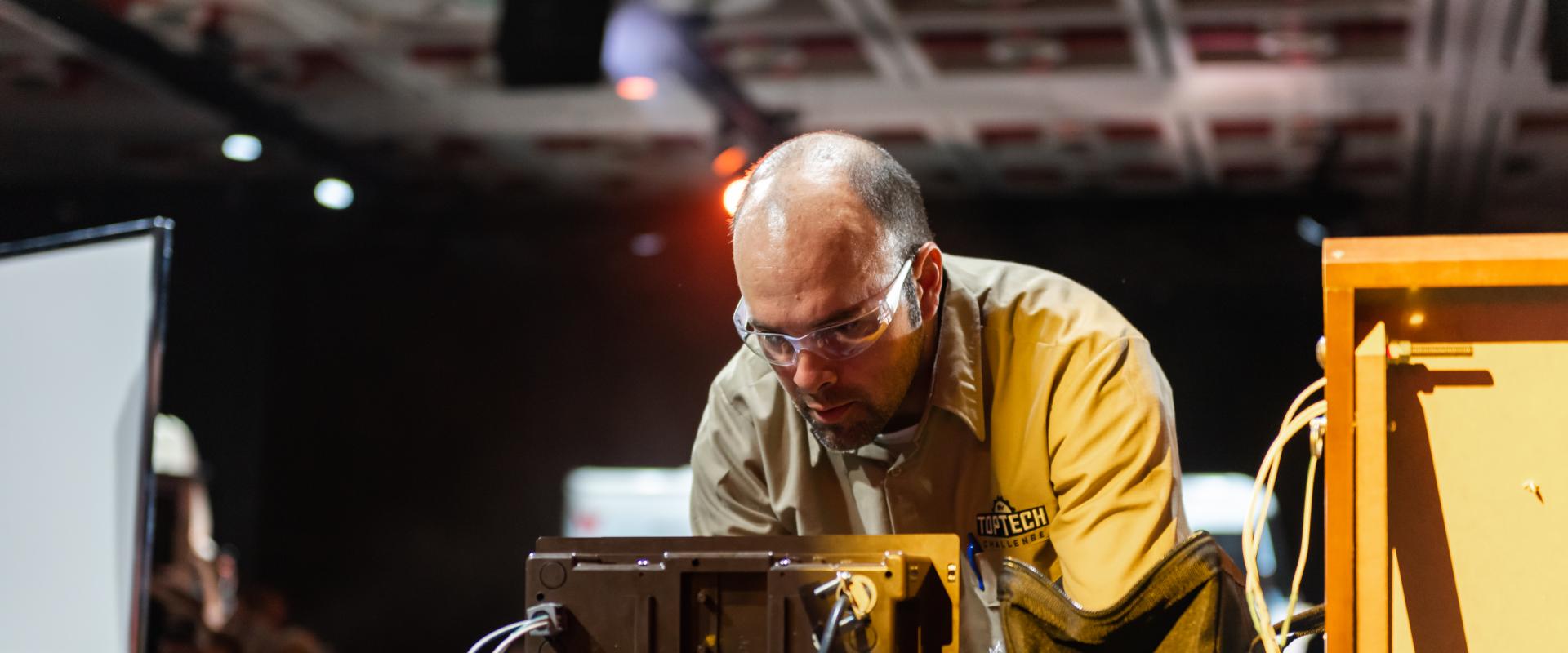 Technician working on box