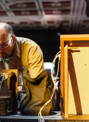 Technician working on box