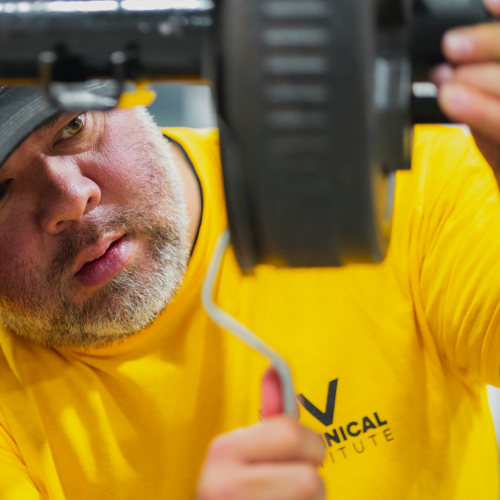 Technician working on axel