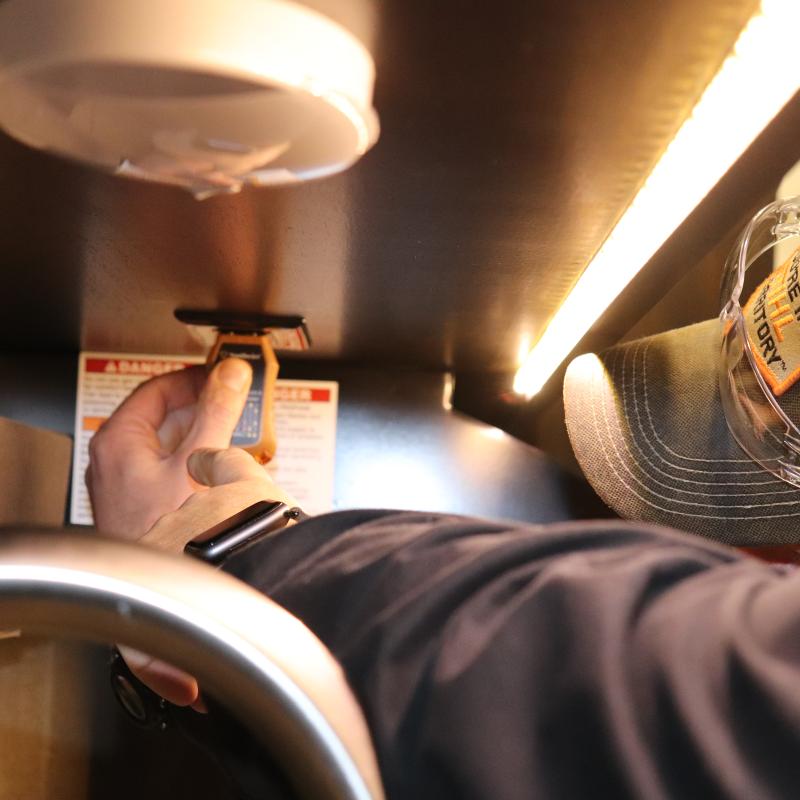 Technician testing electrical outlet