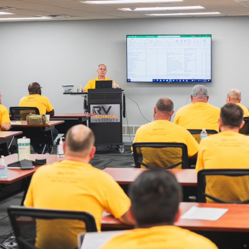 Technicians in a classroom lecture