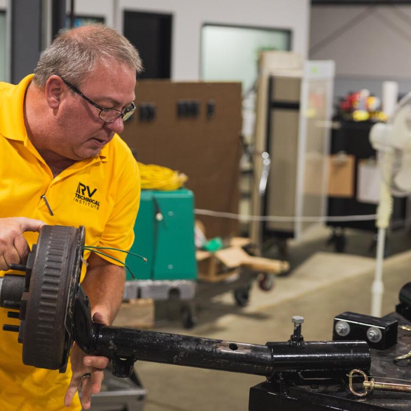 Technician working on an axel